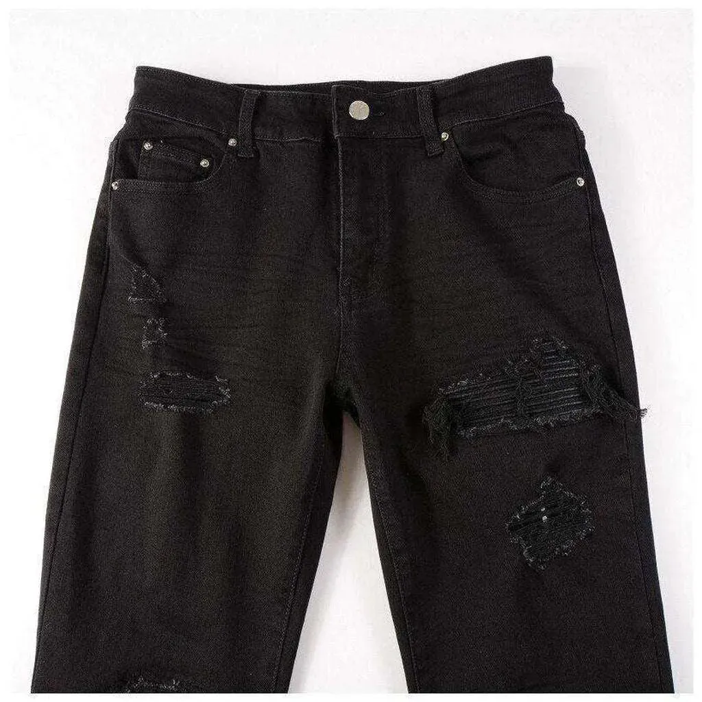 Black leather patch biker jeans